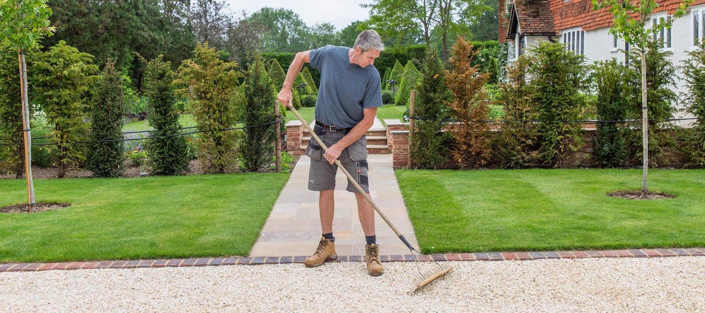 garden maintenance surrey and west sussex raking path